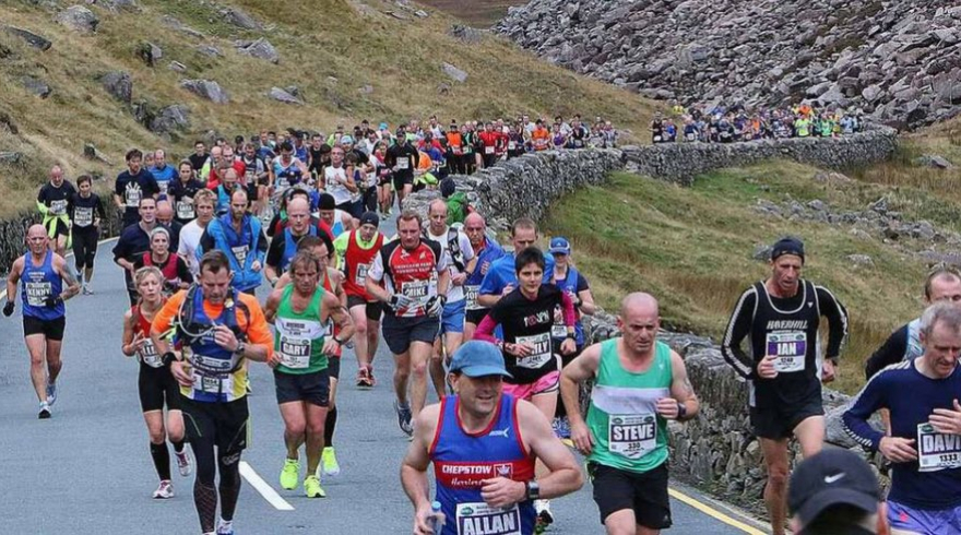 Runners on a trail marathon course through the mountains